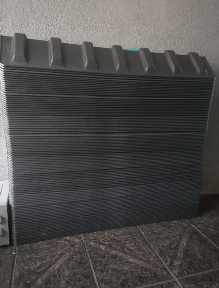Stacked moulded tipper cover panels ready for fitment